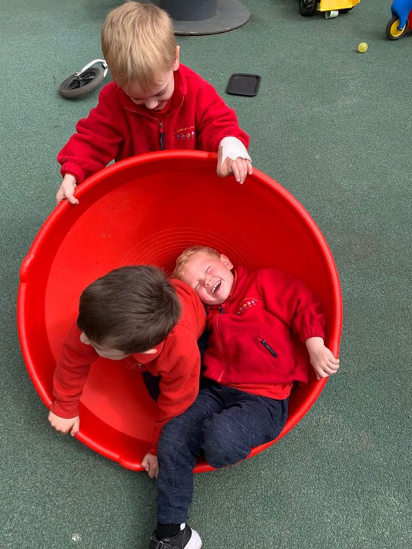 Boys having fun at pre-school playground